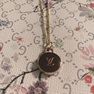 LV Charm Necklace. Brown and Gold charm. Excellent condition